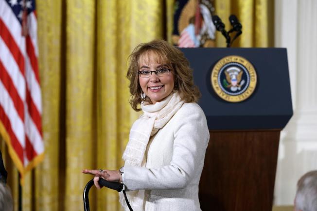 Former US congresswoman, Gabby Giffords, supports President Obama as he address the nation. Photo courtesy of US News.