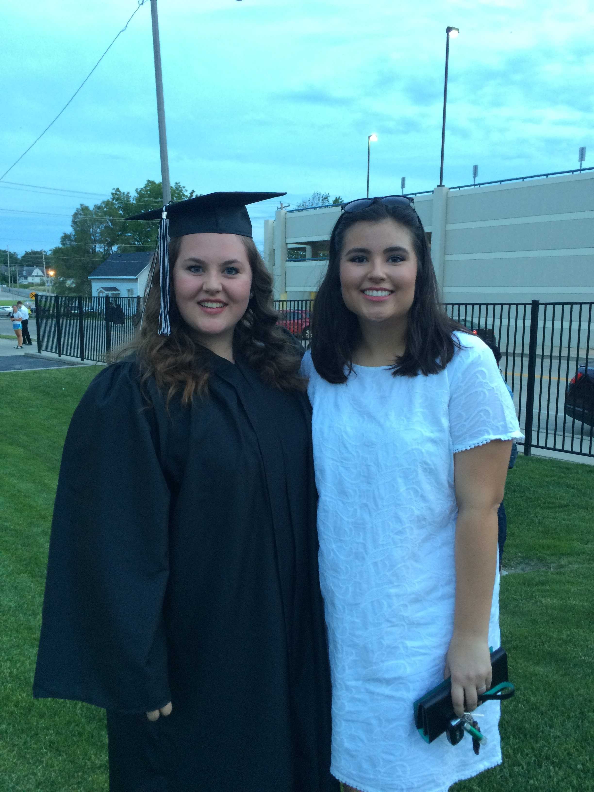 NCWHS alumni, Elli Alvis, and current Paw Print Editor in Chief, Micaela Harris, pose after the class of 2015 was handed their diploma's at the US Cellular Coliseum.