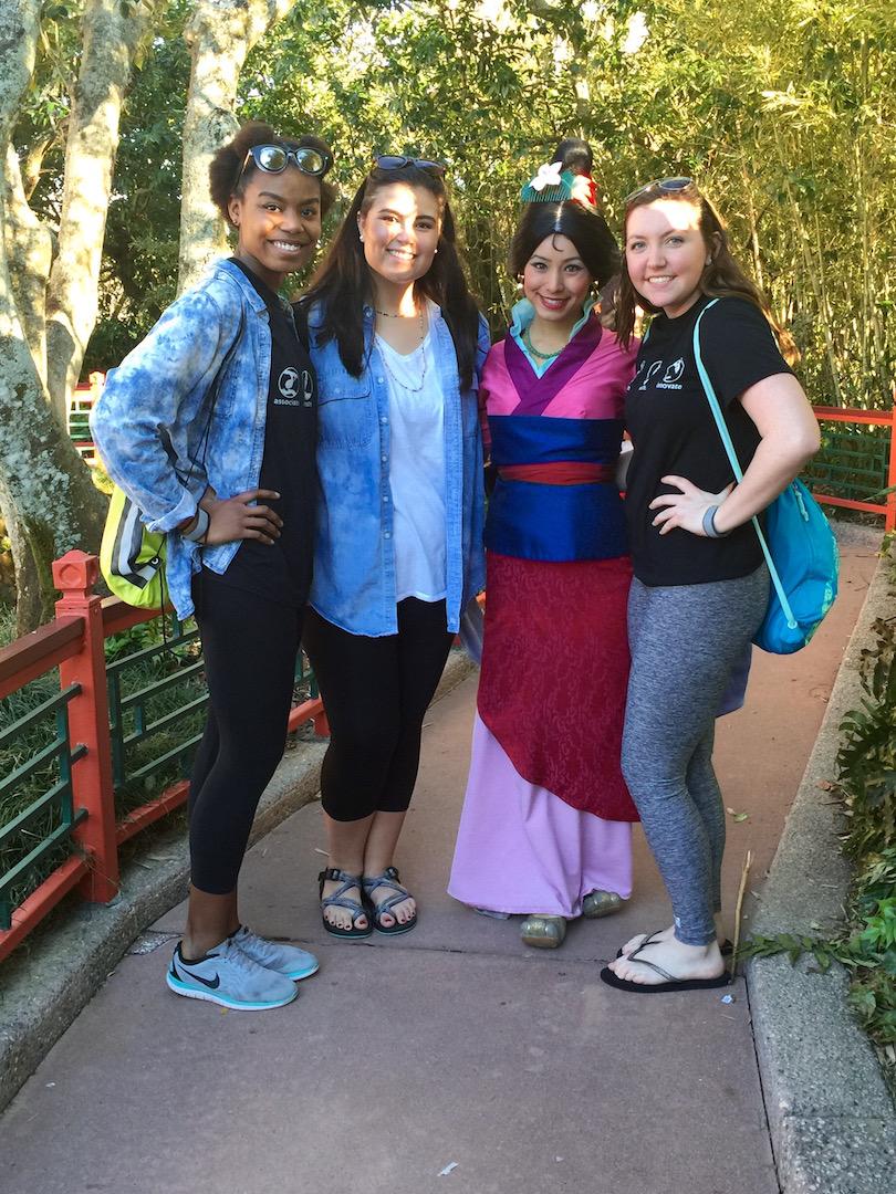 Senior Wildcat Innovative Entrepreneurs (left to right) Allyah Evans, Micaela Harris and Shannon Doherty pose with Disney's Mulan while in Disney World for a leadership conference. 