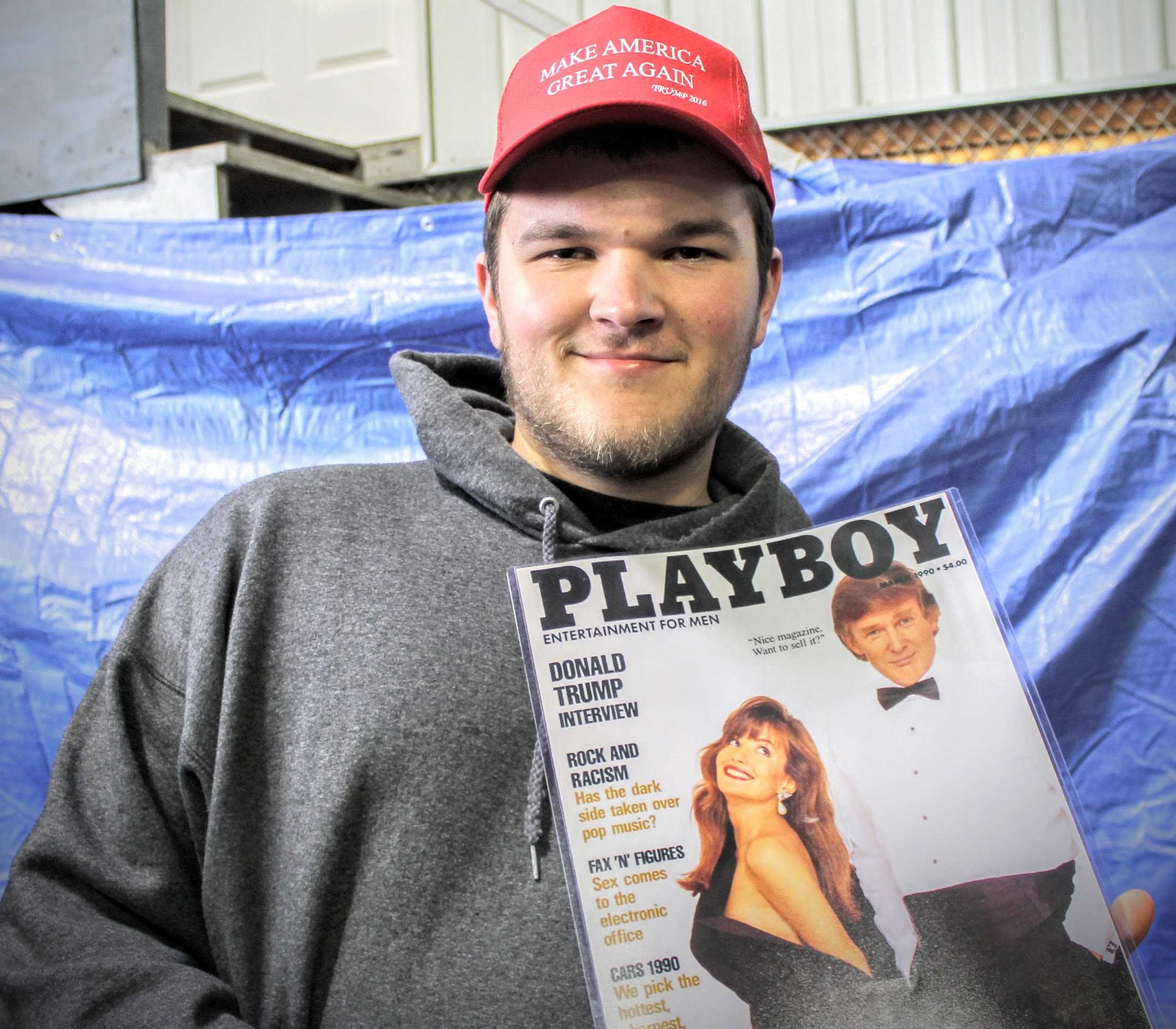 David Schnobrich of Glenview, IL poses with a copy of Playboy magazine, in which Donald Trump appeared in the 1990s. 