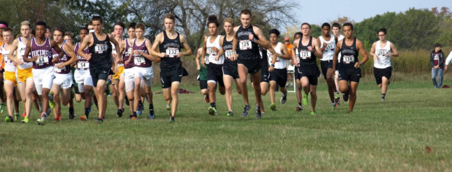 The+Wildcat+boys+cross+country%28in+black%29+get+out+to+a+fast+start+to+earn+second+place+in+the+Big+12+meet+last+Saturday.+Photo+By%3B+Emily+Talaski