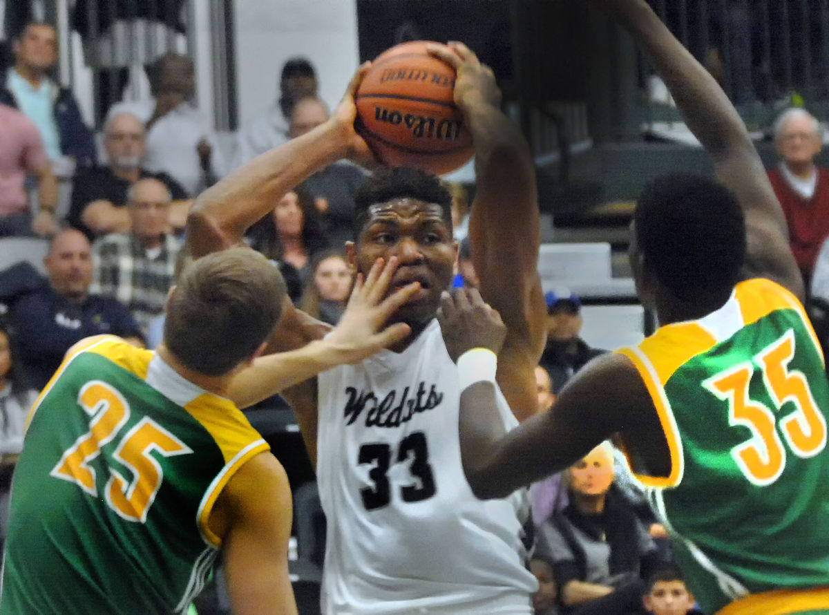 Francis Okoro (11) grabs a rebound against U-High in the Intercity Tournament.