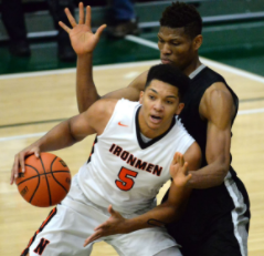 Francis Okoro(11), defends C.J. Wilbourn(11) during the intercity tournament at the Shirk Center.