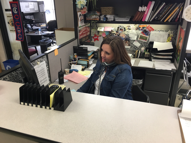 Mrs.+Nikolanci+takes+a+phone+call+from+a+parent+calling+their+student+out+of+school+for+an+appointment.++She+is+anticipating+a+very+busy+day+on+Monday%2C+April+16th--%22Senior+Skip+Day%22.