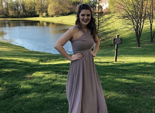 Prom+expert+Briana+Turcotte+poses+before+the+last+prom+she+attended+in+2017+before+she+graduated.%0D%0A
