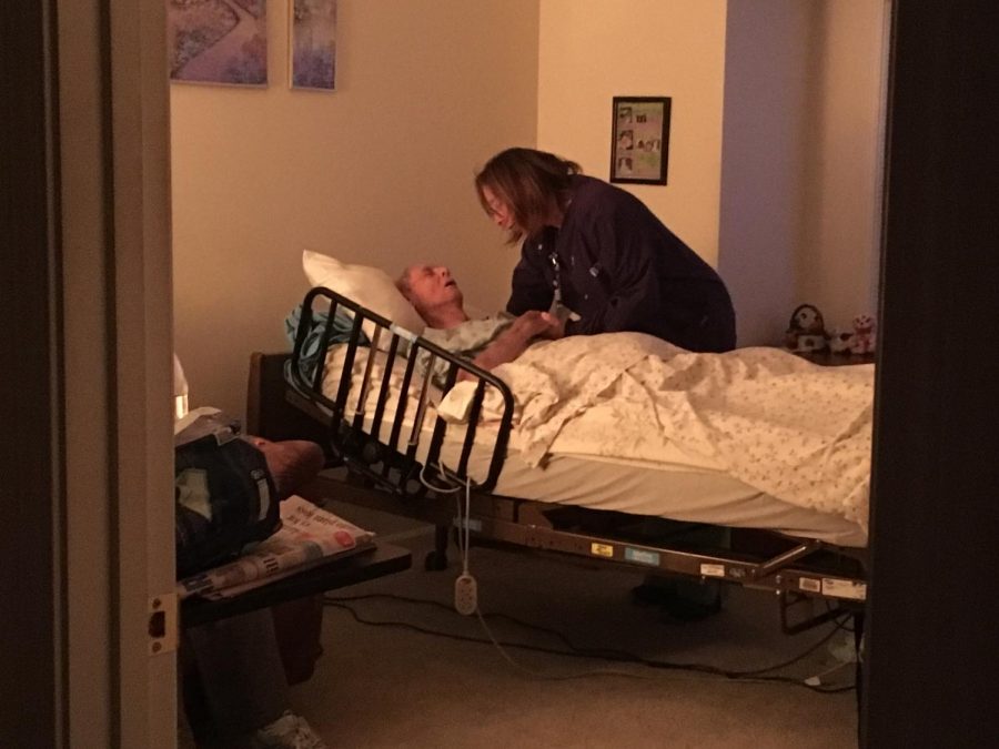 Vitas+worker+Sarah+Freestone+says+goodnight+to+her+patient+Raymond+at+the+end+of+her+shift.