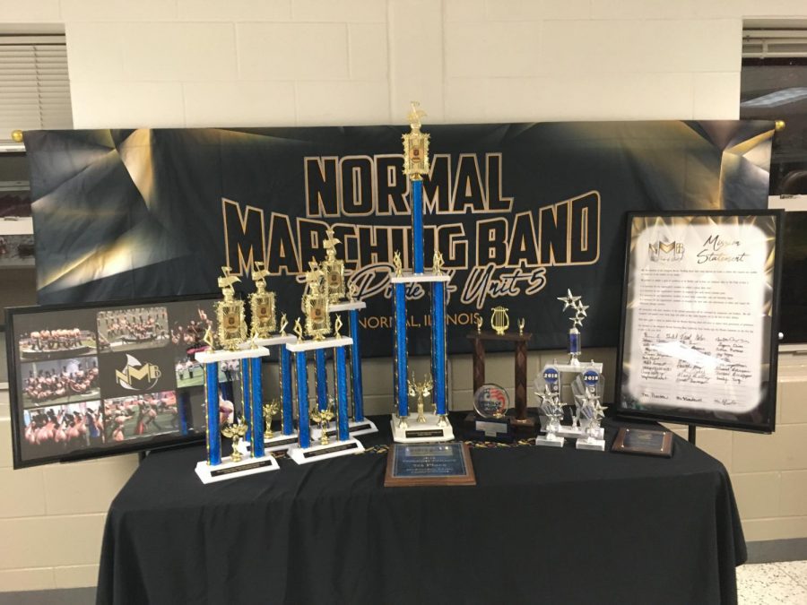 +The+NMB%E2%80%99s+banner%2C+trophies%2C+photos+and+mission+statement+on+display+at+the+Unit+5+Music+Parents+Spaghetti+Supper+at+West.+Photo+by+Ariana+South.